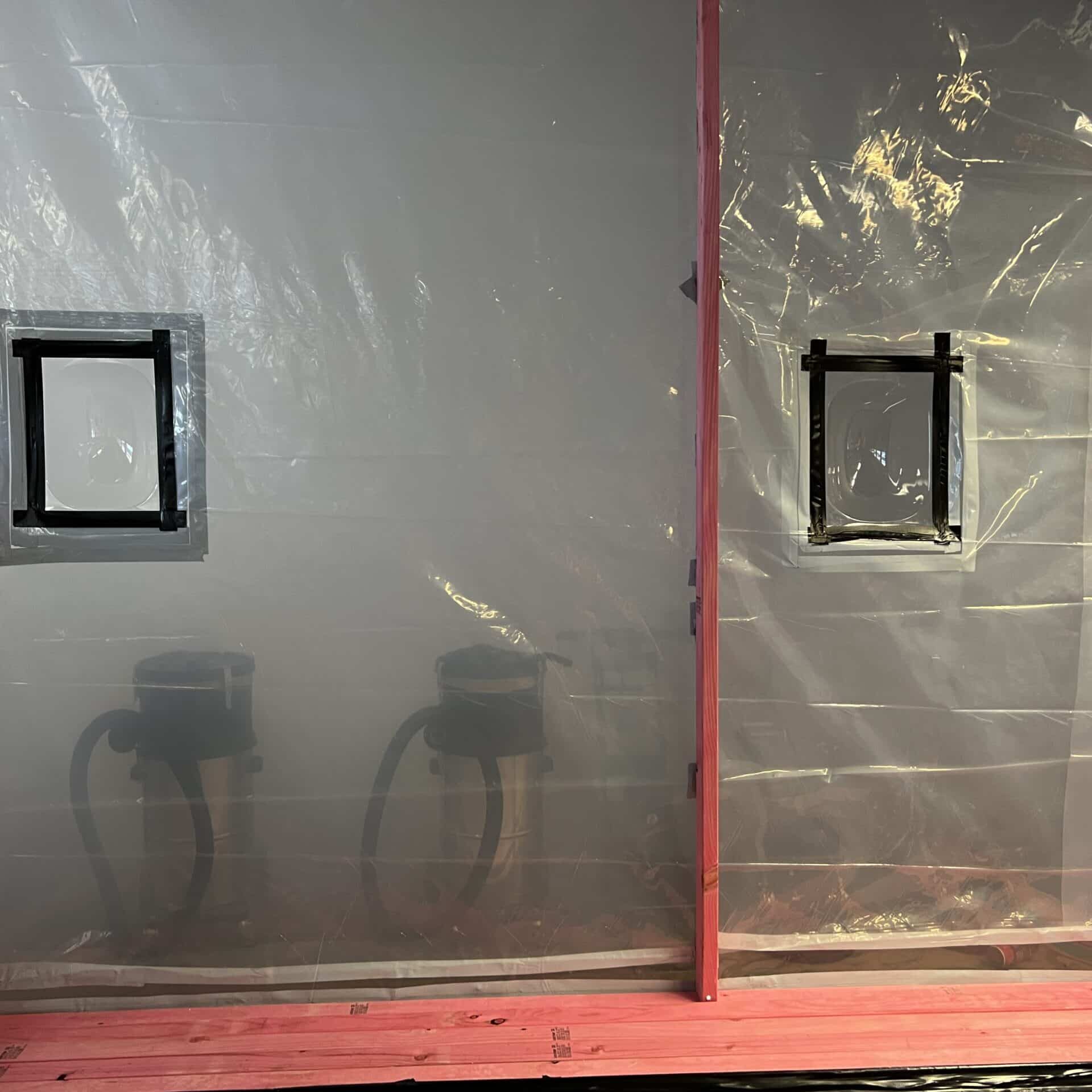 Smoke testing the asbestos removal enclosure to ensure it is air tight