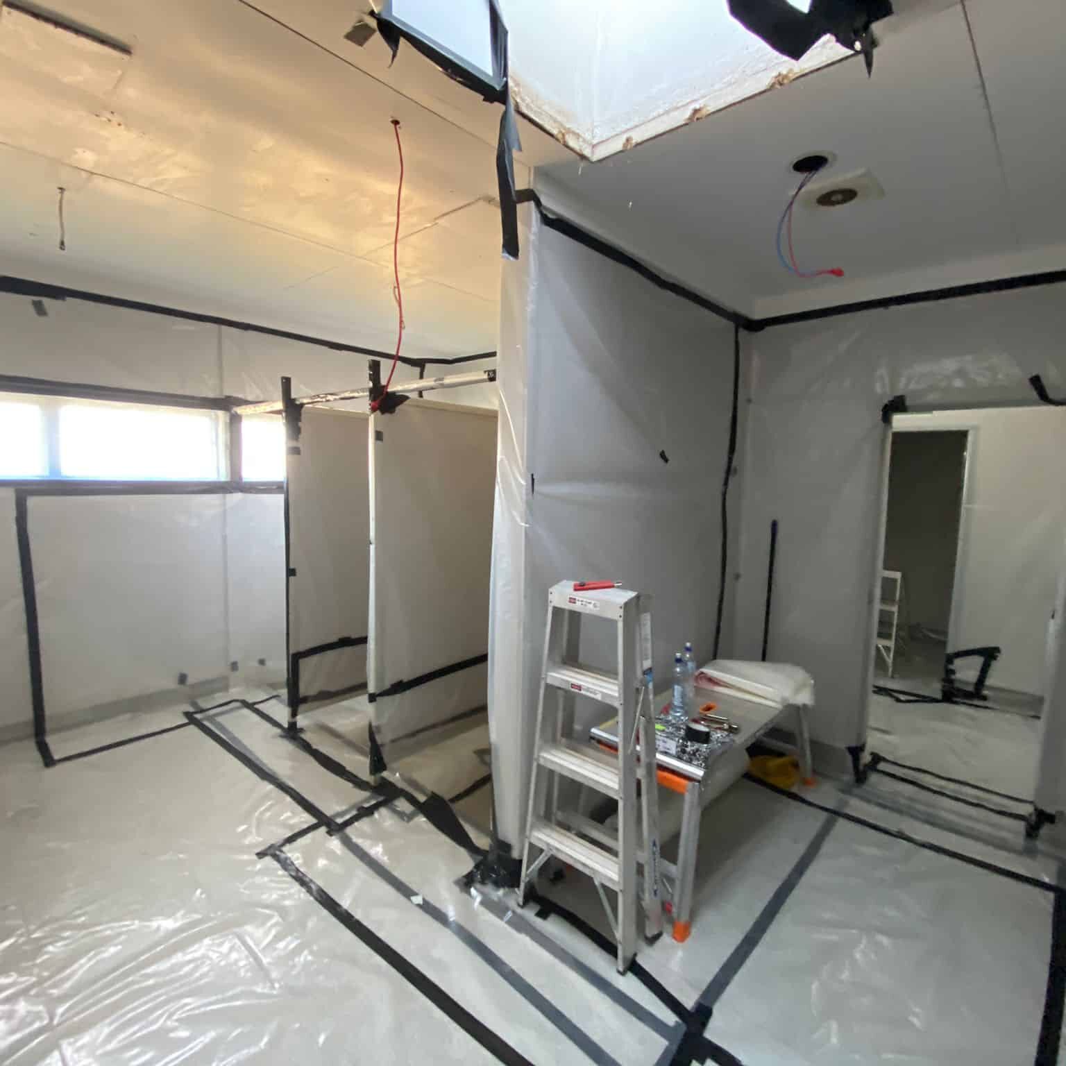 Internal shot of bathrooms in a commercial premise set up for Class B Asbestos removal
