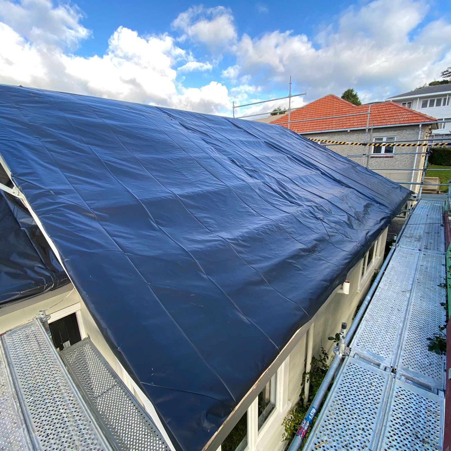 Class B Asbestos roof removal temporary weather proofing in Auckland.